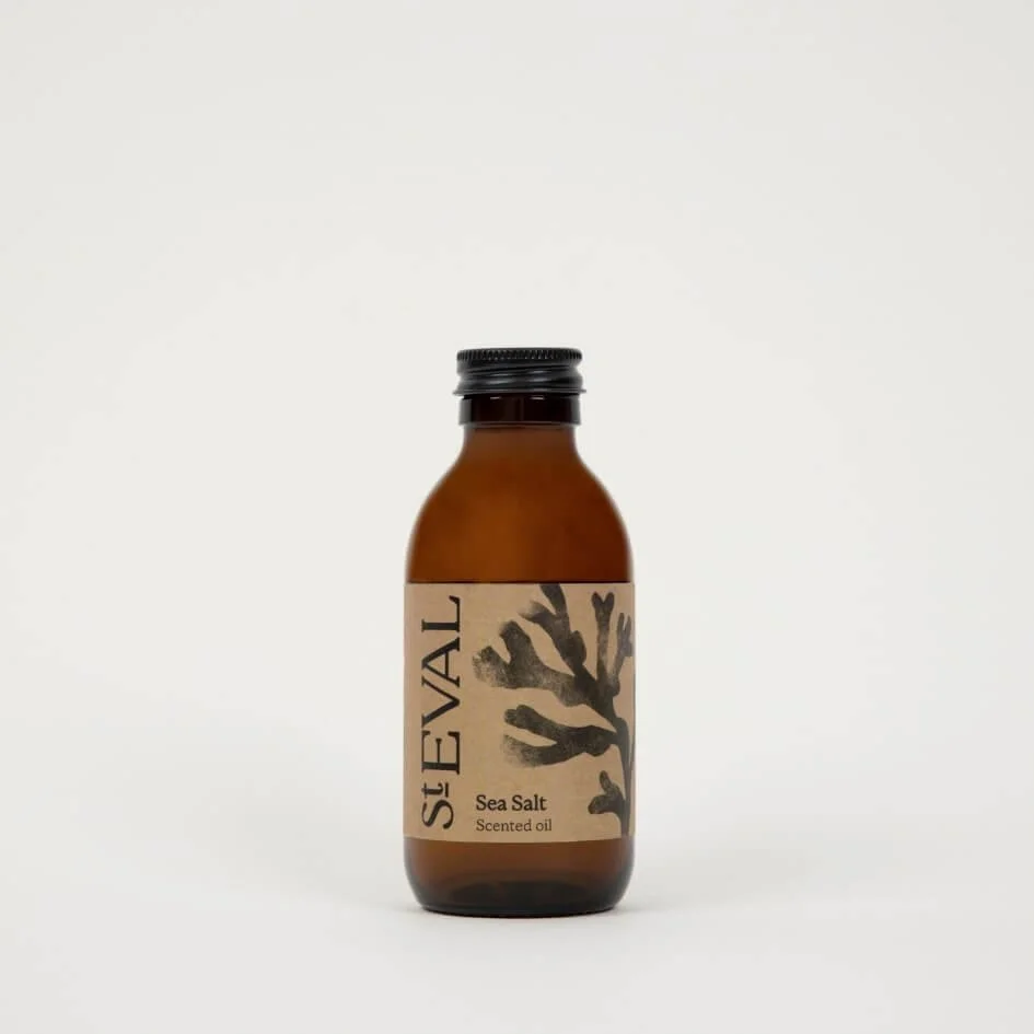 Amber glass refill bottle of St. Eval Sea Salt scented oil with kraft label