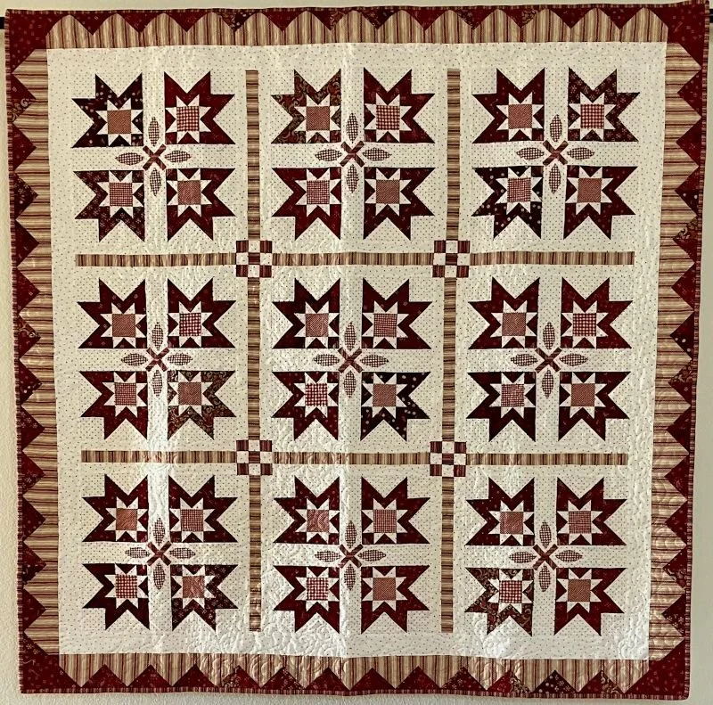 Katniss 58" x 58" 10/25 Garnets and Lilies by Kim Dheil