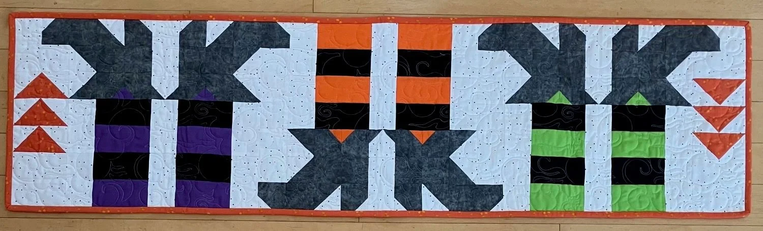 Kornier 14" x 53" 10/26 Witches Feet Table Runner by Block Party Quilt Company