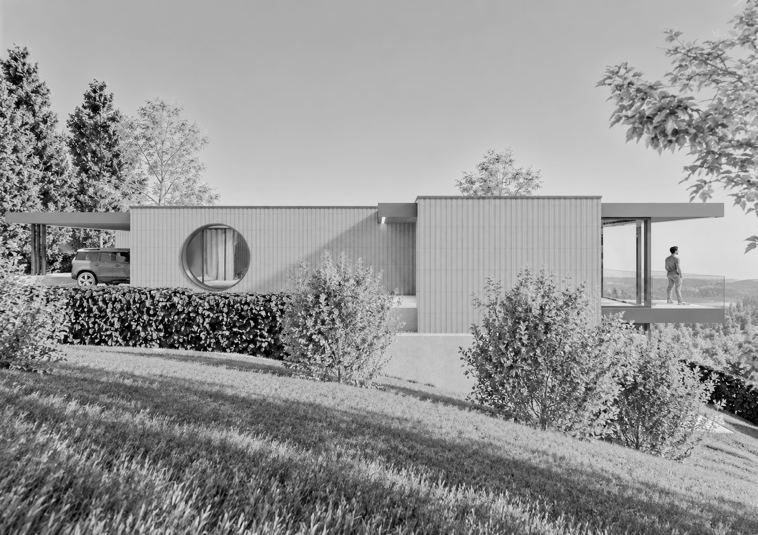 Schlichtes modernes Haus mit Carport auf einer erhöhten Grundstücksfläche, umgeben von Büschen und Bäumen.