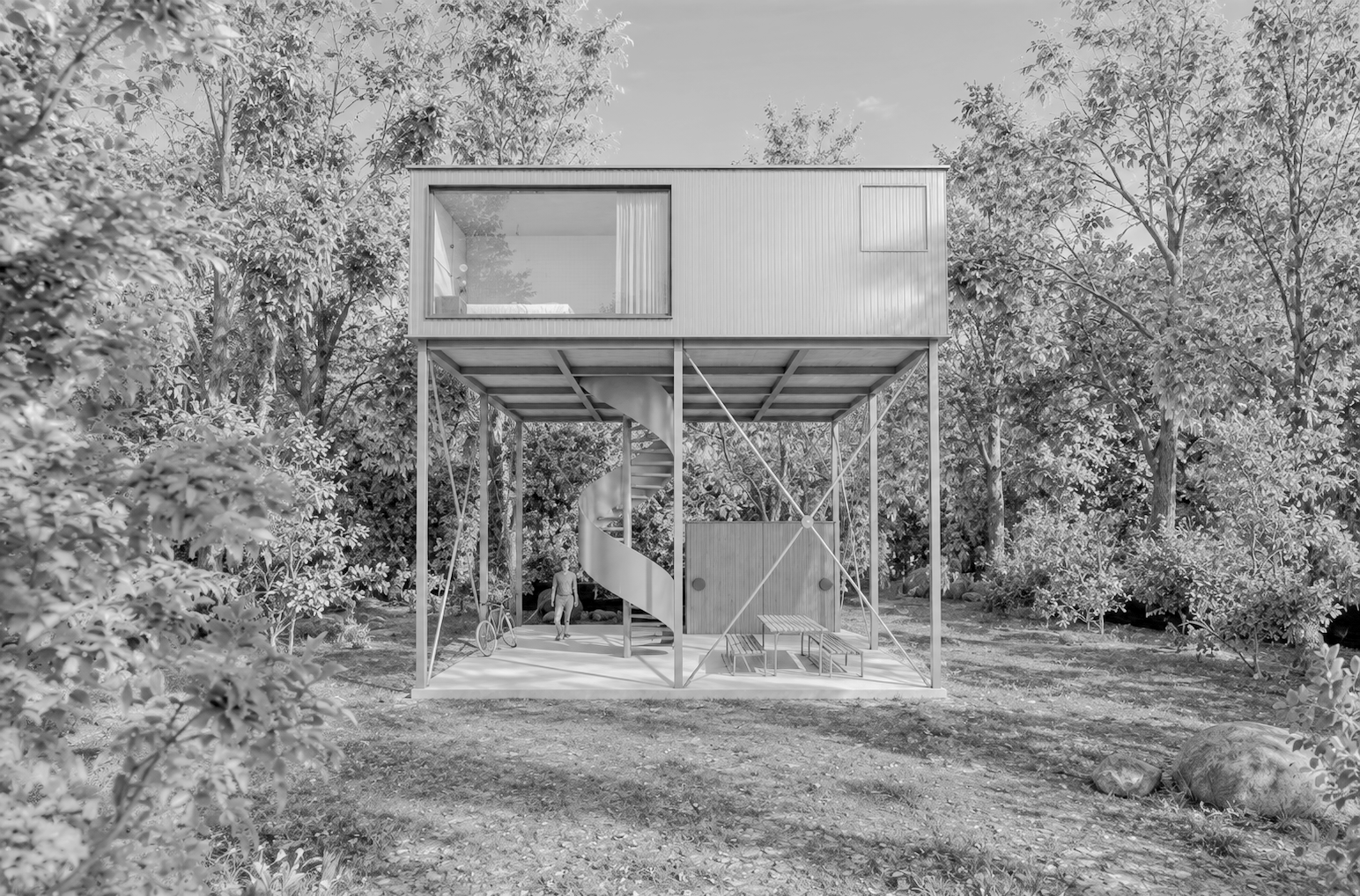 Ein modern gebautes Haus auf Stelzen inmitten eines Baumschattens, sichtbar ist eine spiralförmige Außentreppe, eine Person mit Fahrrad. Das Haus hat einen offenen unteren Bereich mit Gartentisch und Bänken, und einen geschlossenen oberen Bereich mit einem großen Fenster.