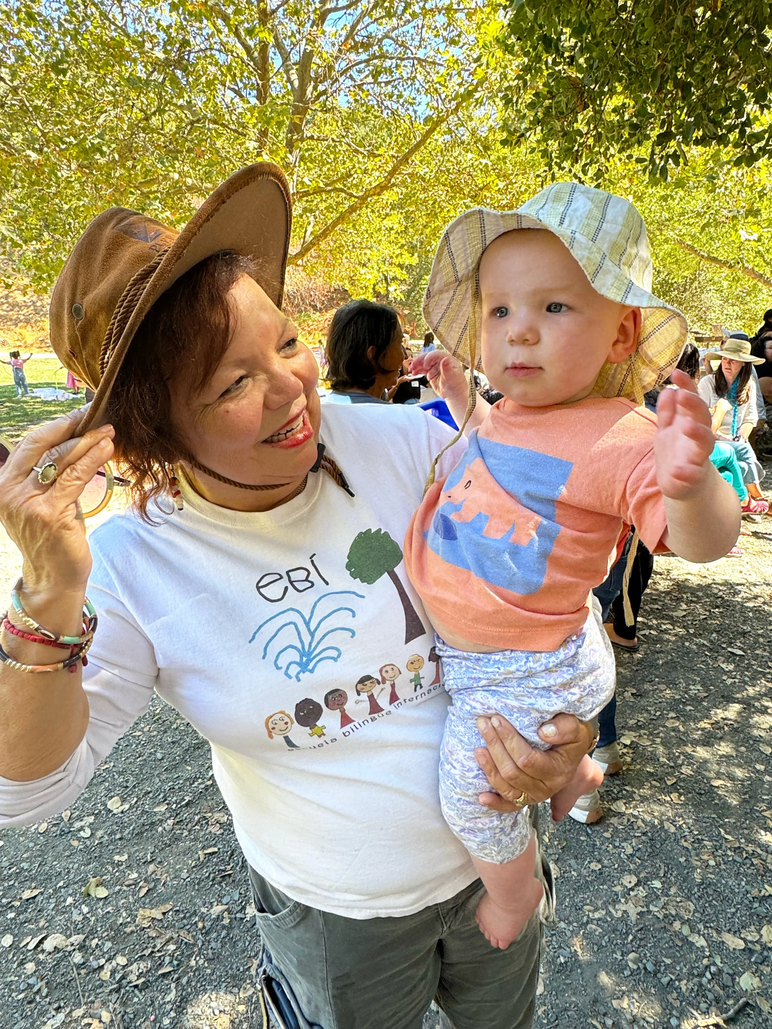 Teacher and young child pose at the Back to School Picnic