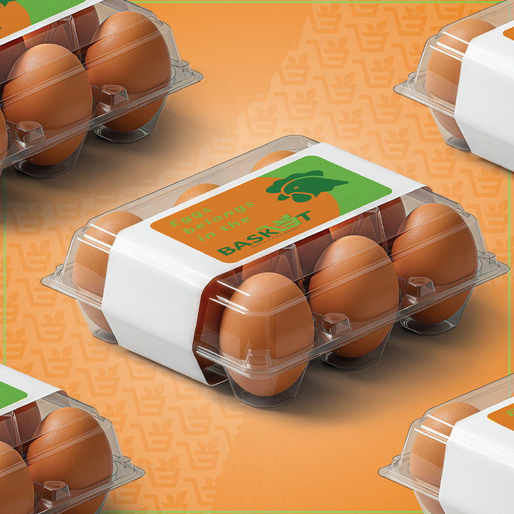 A package of brown eggs in a clear plastic carton labelled “Eggs belong in the BASKET”, with more cartons on an orange background.