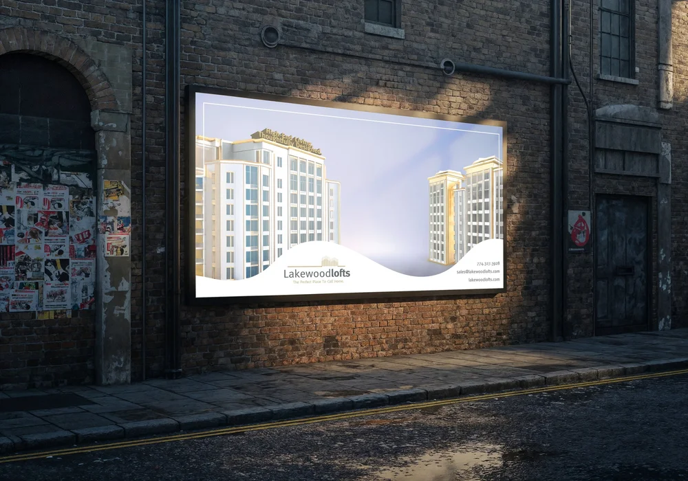 Lakewood Lofts billboard on a brick wall: a rendering of the high-rise buildings with the logo, contact details and slogan.