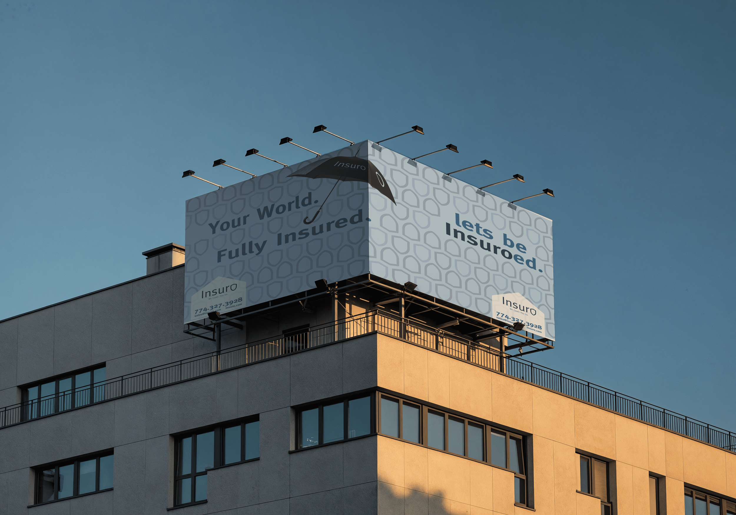 Large billboard on top of a building promoting insurance with the text "Your World. Fully Insured. lets be Insurred." a logo and contact information made by vivfty!