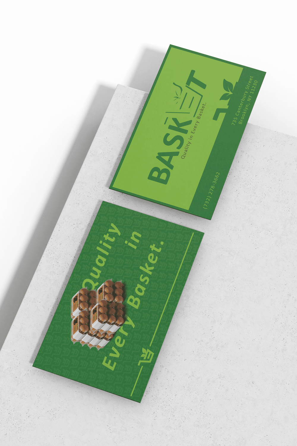 Business cards in the green Basket theme with the stylized basket logo.