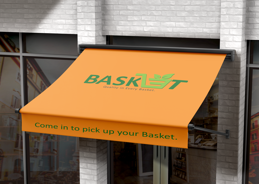 Orange store awning with the green BASKET logo and the tagline “Quality in Every Basket.”