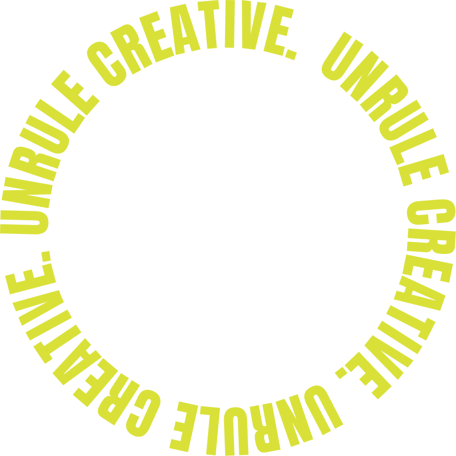Circular text in yellow-green reading 'UNRULE CREATIVE. UNRULE CREATIVE. UNRULE CREATIVE. UNRULE CREATIVE.' on a black background.