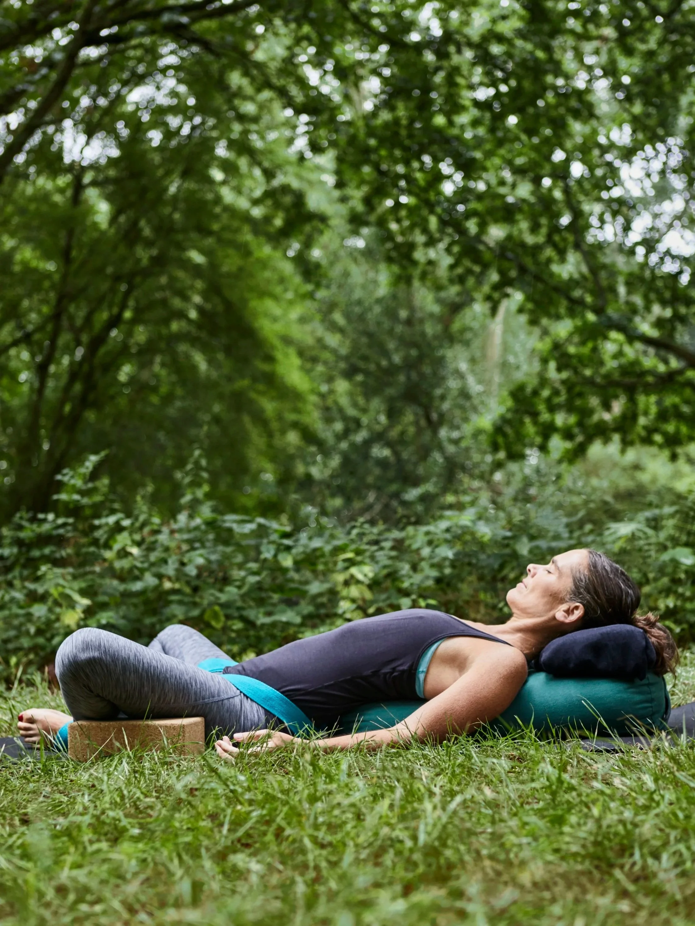Restorative Yoga pose on grass