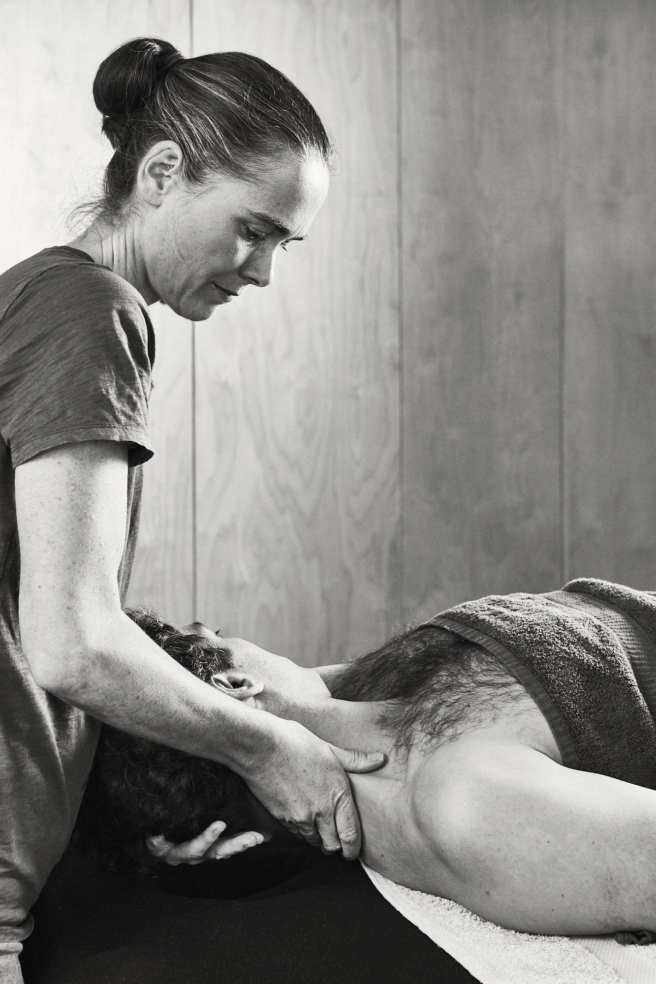 Massage therapist gives remedial massage
