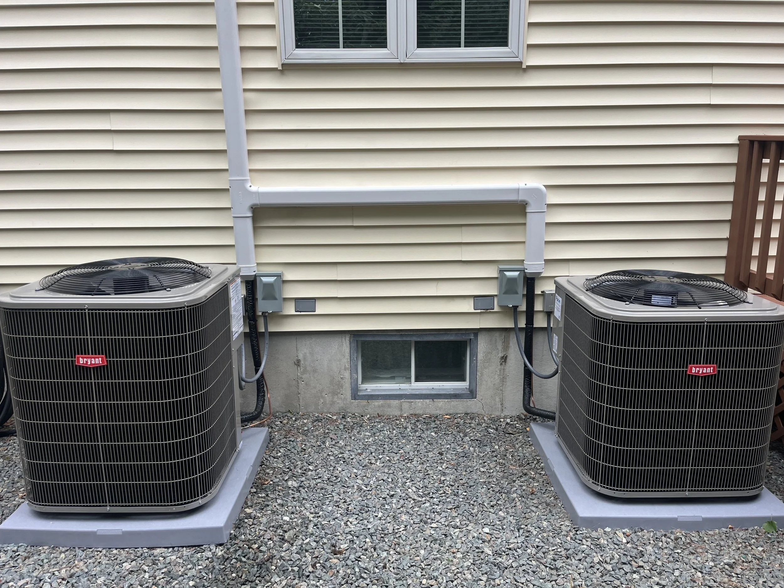 Bryant outdoor air conditioning condenser units installed by Roy and Pacheco Mechanical in Southern MA
