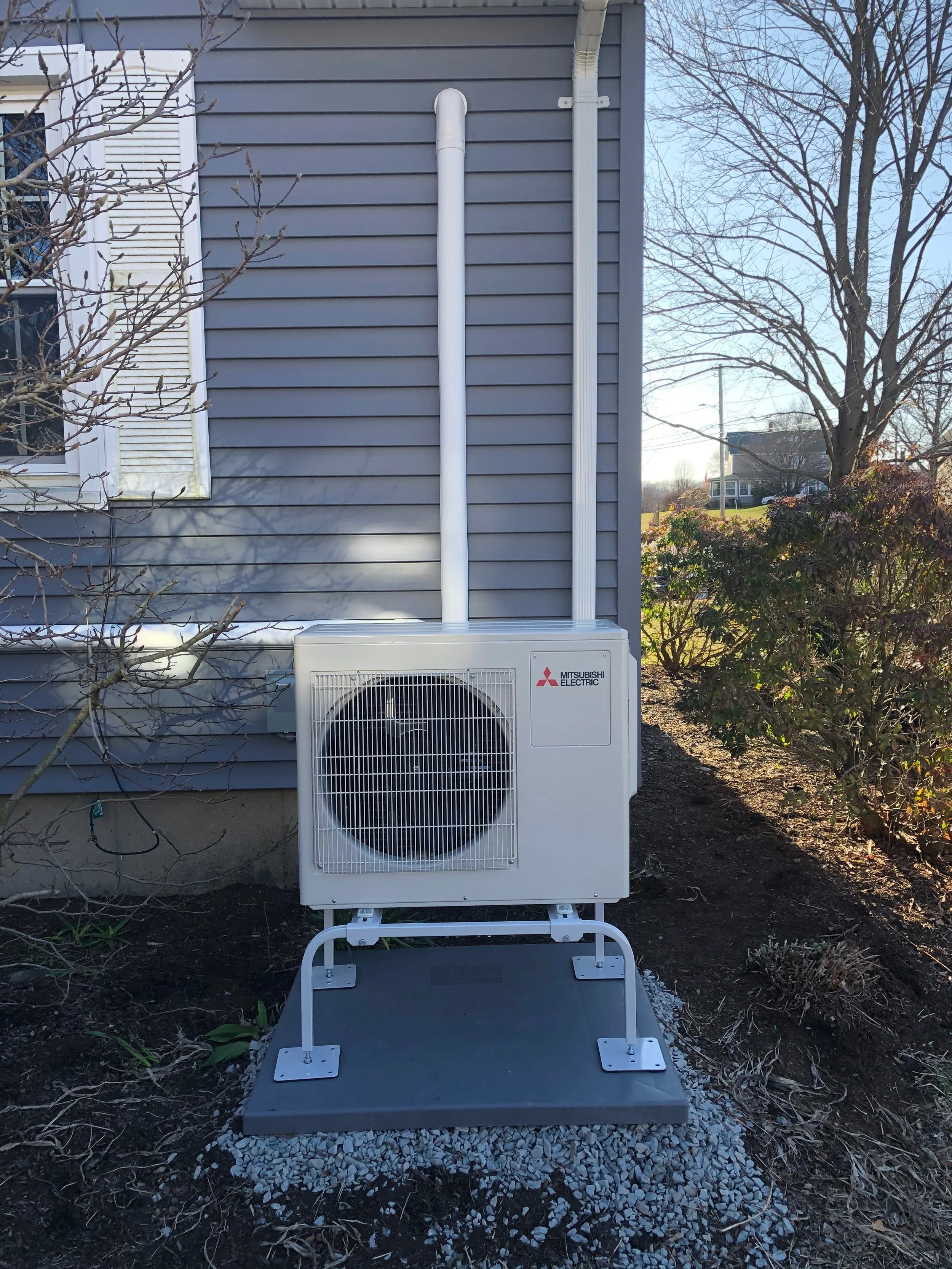 Outdoor Mitsubishi Electric ductless mini-split heat pump condenser installation by Roy and Pacheco Mechanical LLC in Southeastern MA.jpeg