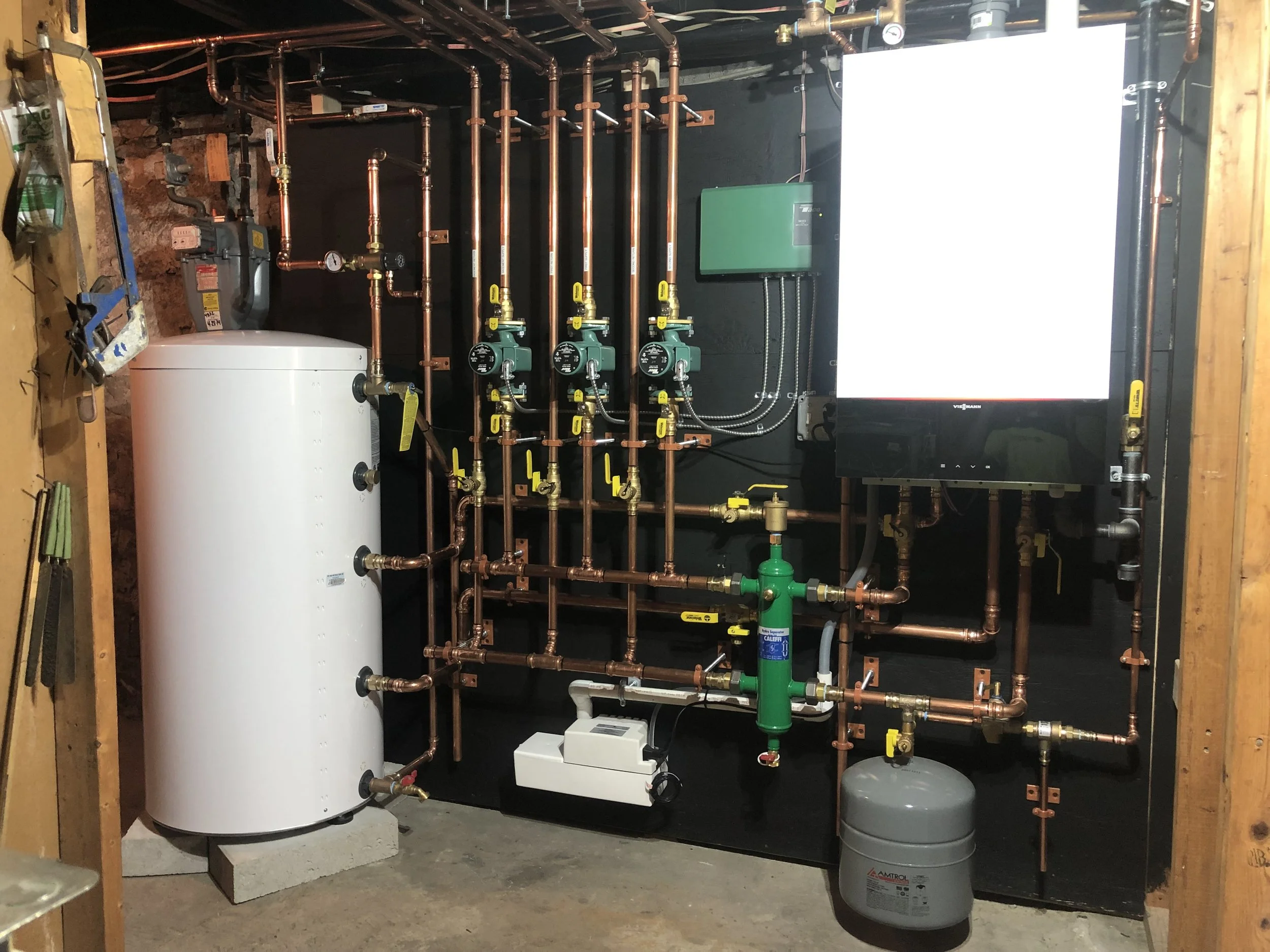 Residential boiler system install with copper piping and circulator pumps in Swansea MA by Roy and Pacheco Mechanical LLC