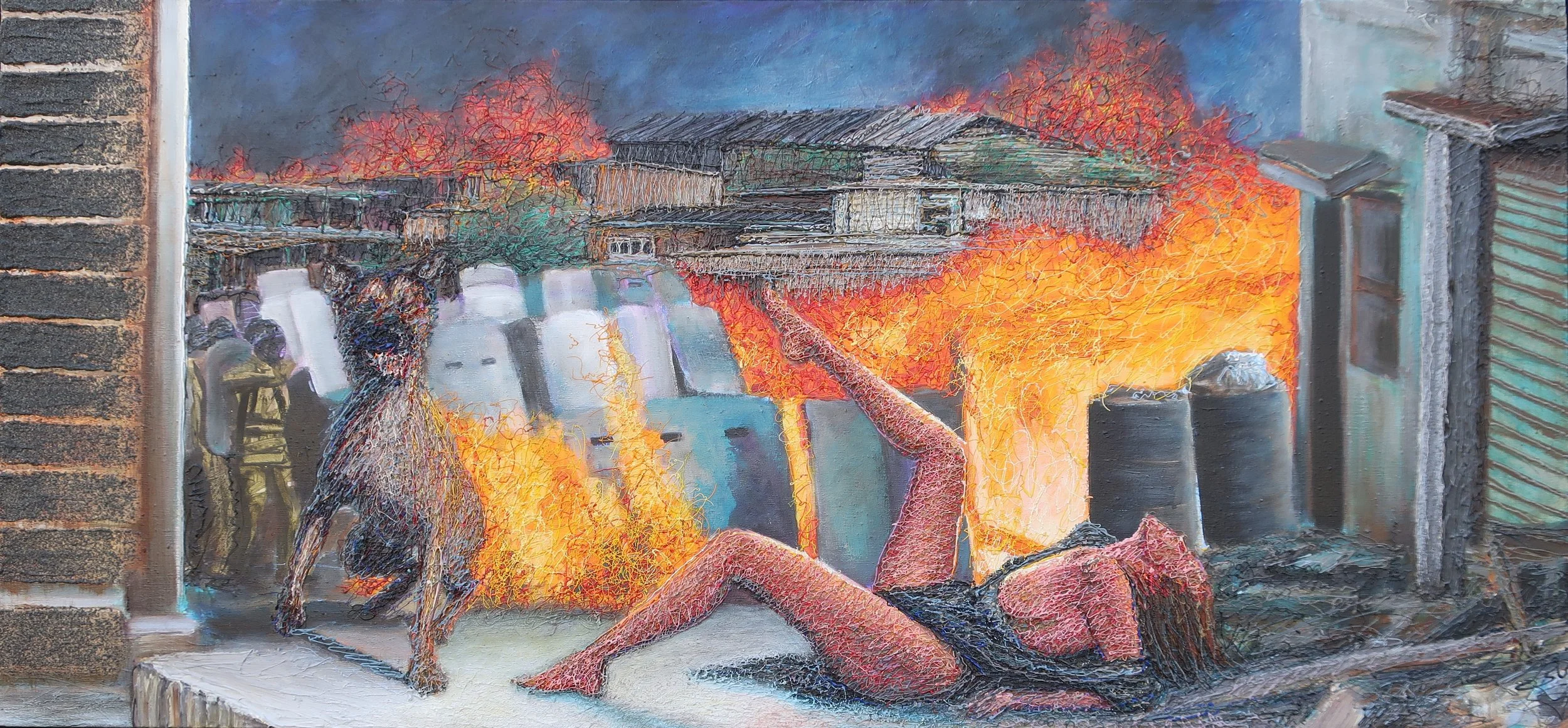 A mural depicting a woman with long hair lying on the ground, a dog sitting nearby, and a large fire with smoke in an urban setting.
