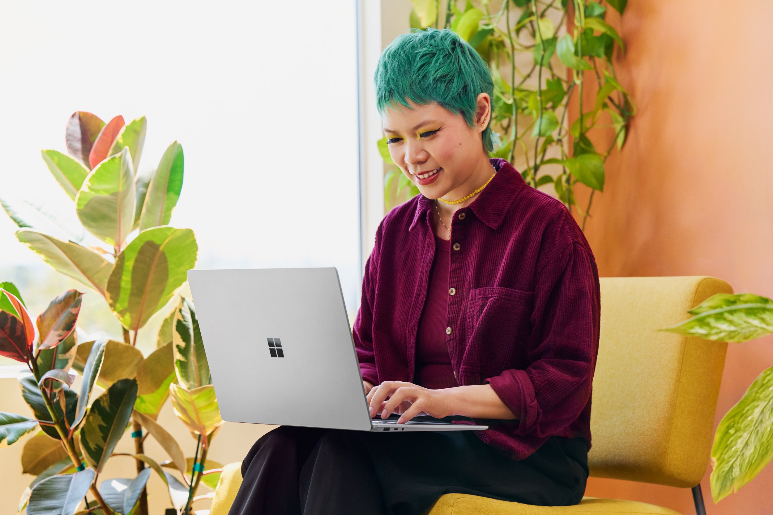 Goldie Chan with Microsoft Surface Laptop
