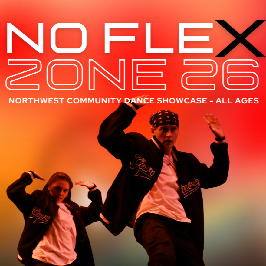 Multiple women participating in a dance or fitness class in a dark studio, with hair and movement captured mid-action.