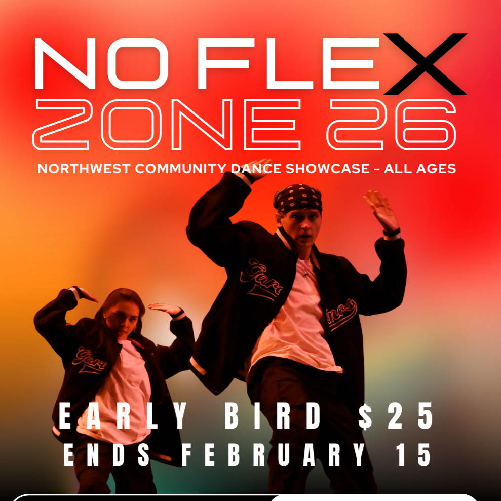 Multiple women participating in a dance or fitness class in a dark studio, with hair and movement captured mid-action.