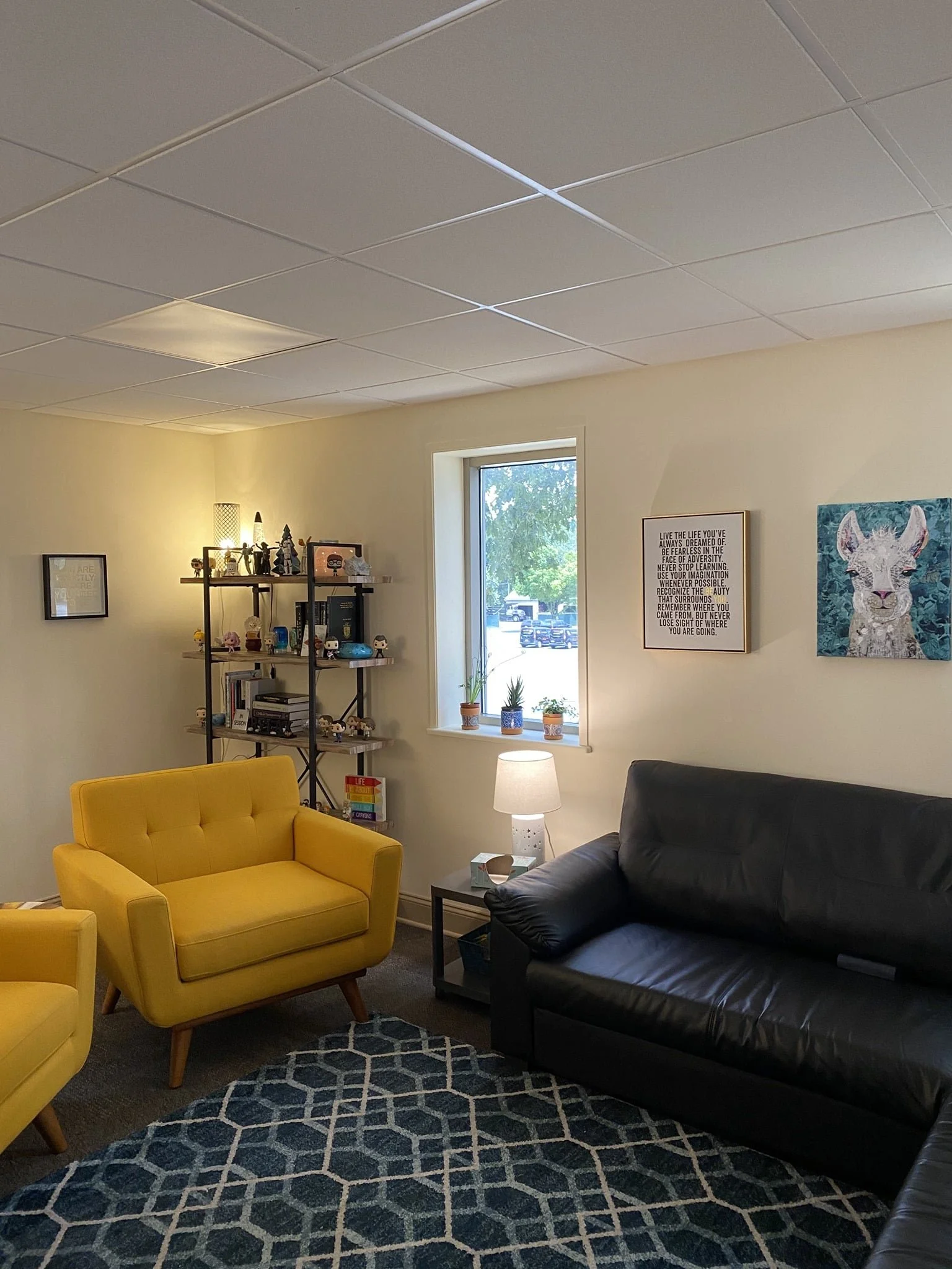 Inviting office with yellow chairs and couch