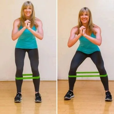 An athlete performing lateral band walks to strengthen the gluteus medius and permanently cure IT band knee pain.