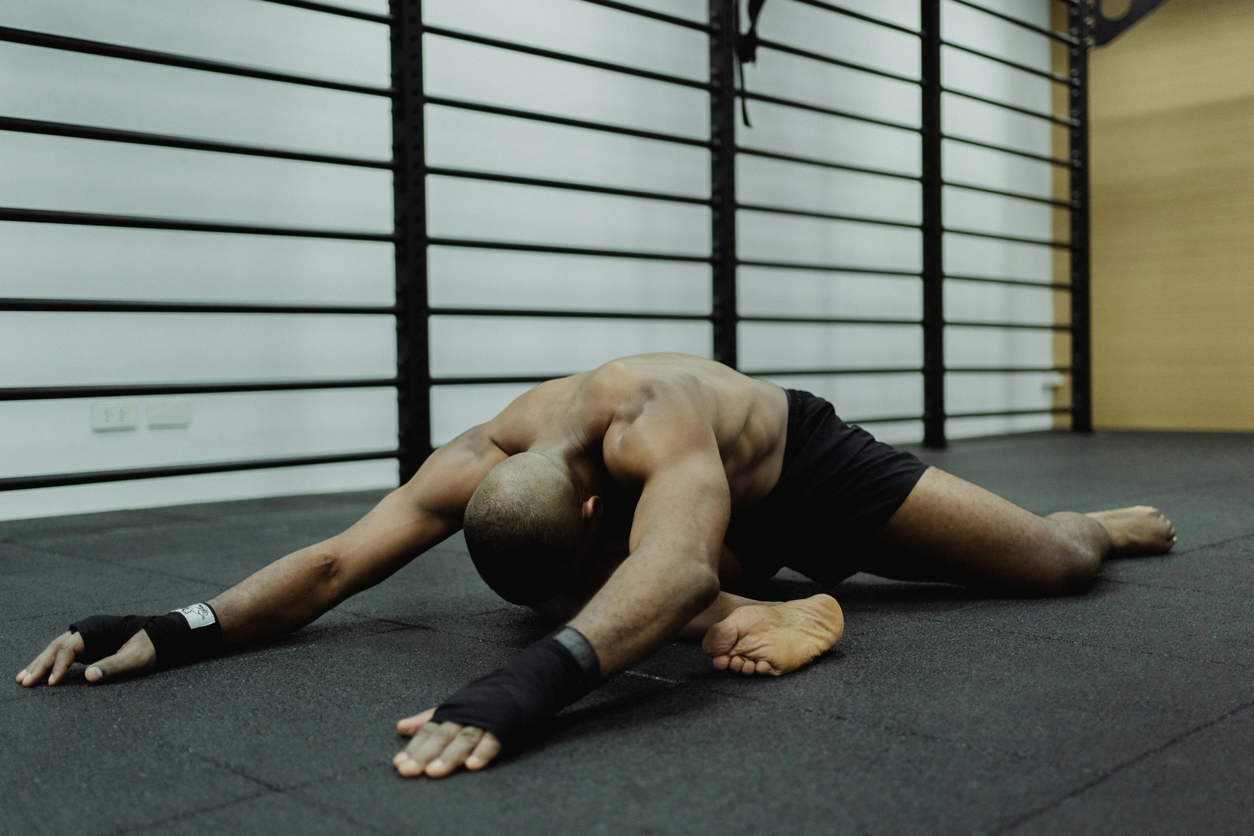 Man stretching his hips to show the sensation versus reality of stretching