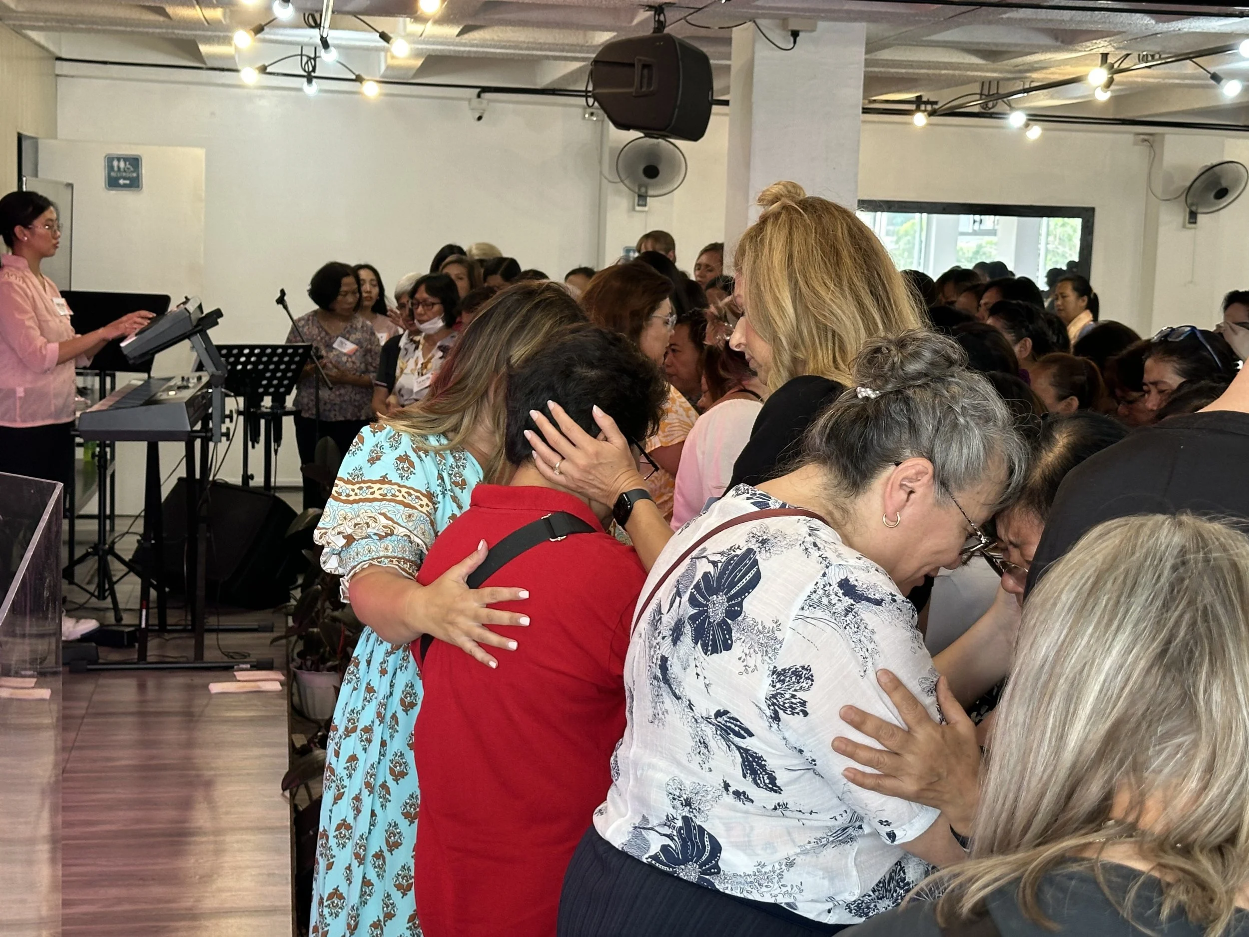 Praying with women at the conference