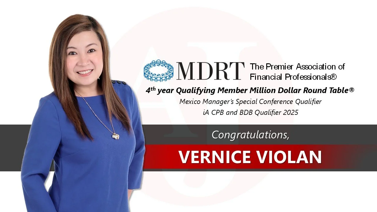 Woman in a blue dress smiling, standing in front of a presentation slide. The slide contains text congratulating Vernice Violan for her qualification with the MDRT association, with logo and details about the event.