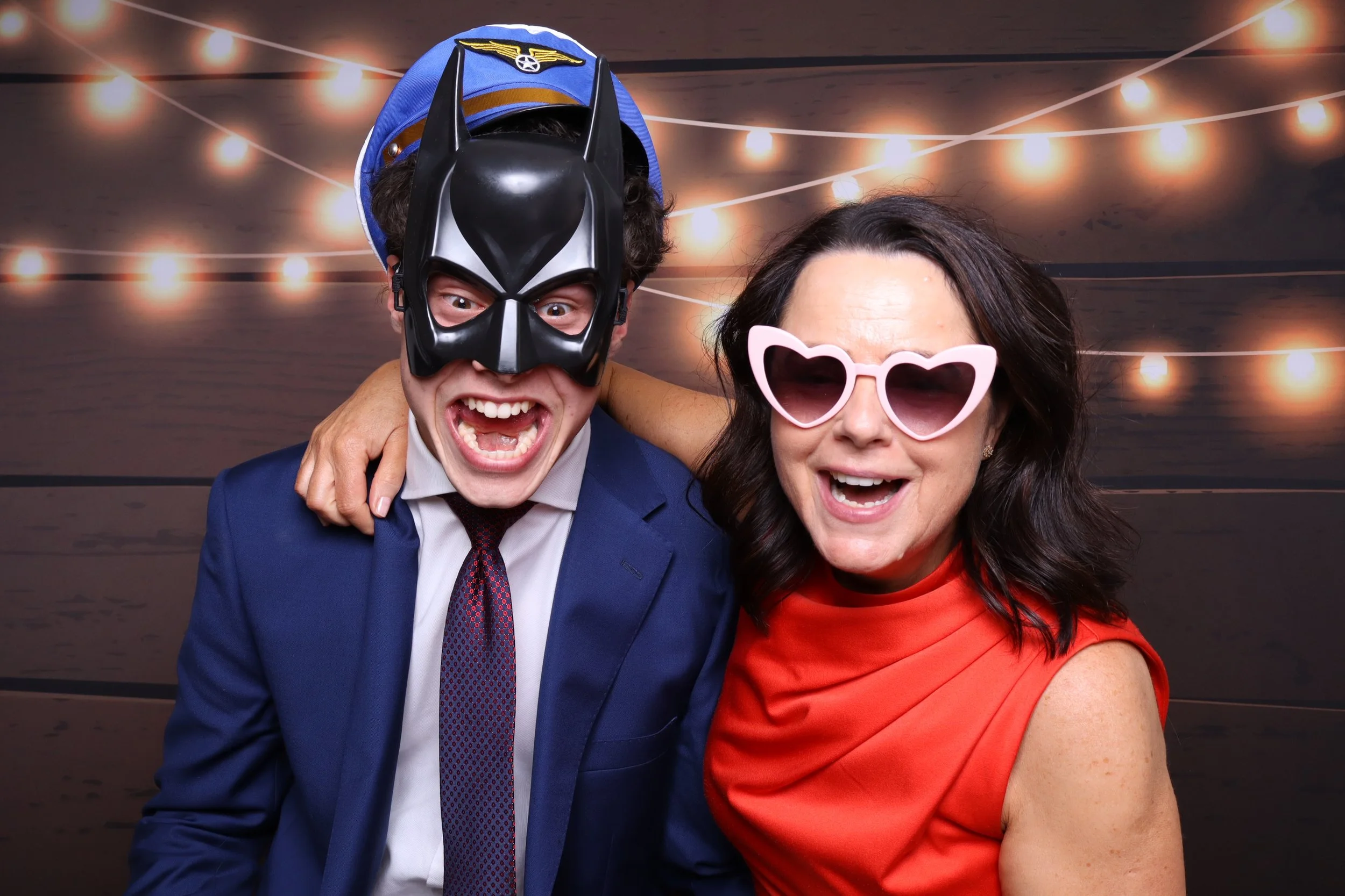 Friends posing in colour photo booth at Melbourne wedding