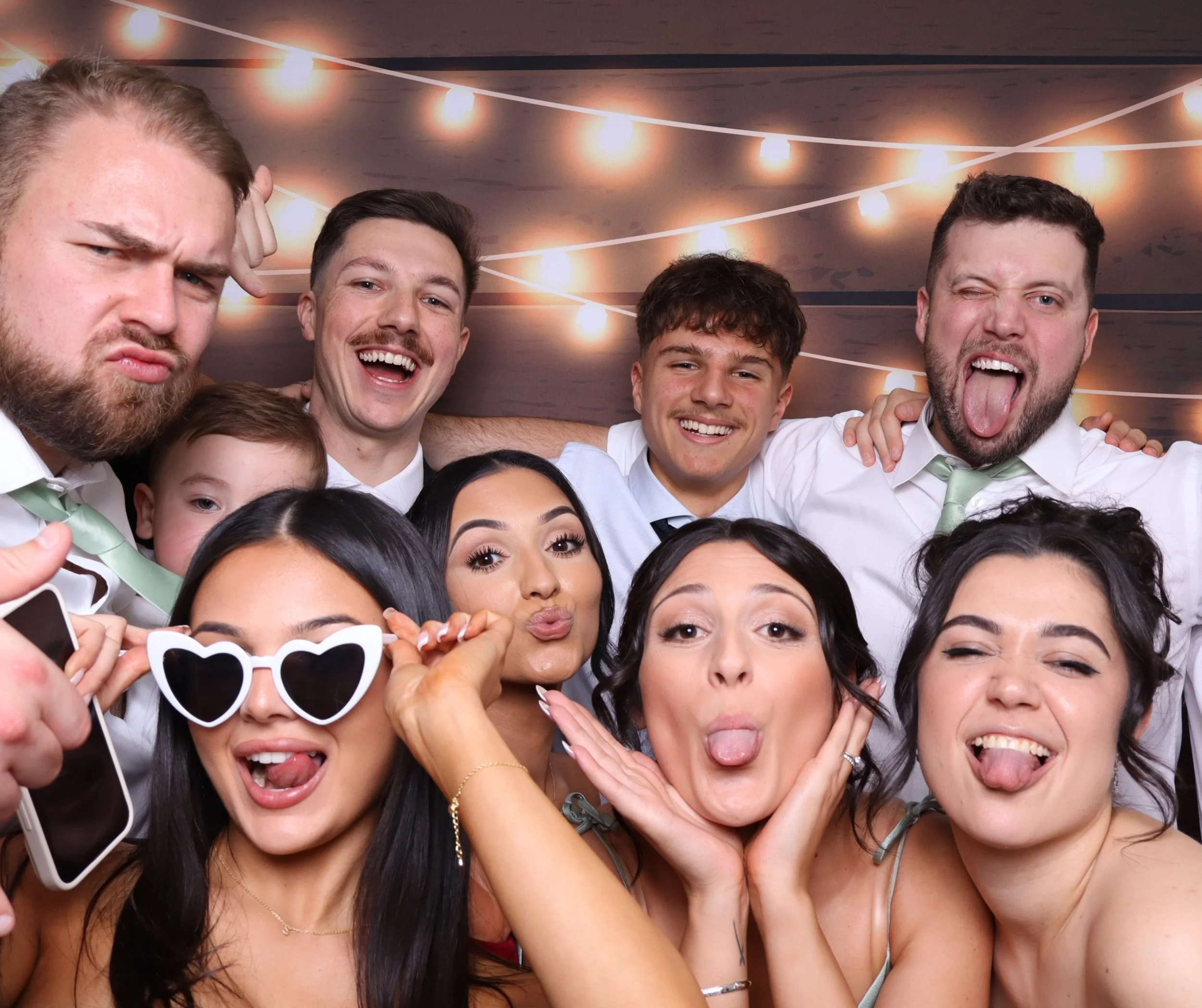 Open photobooth with props and happy guests celebrating a birthday in Melbourne