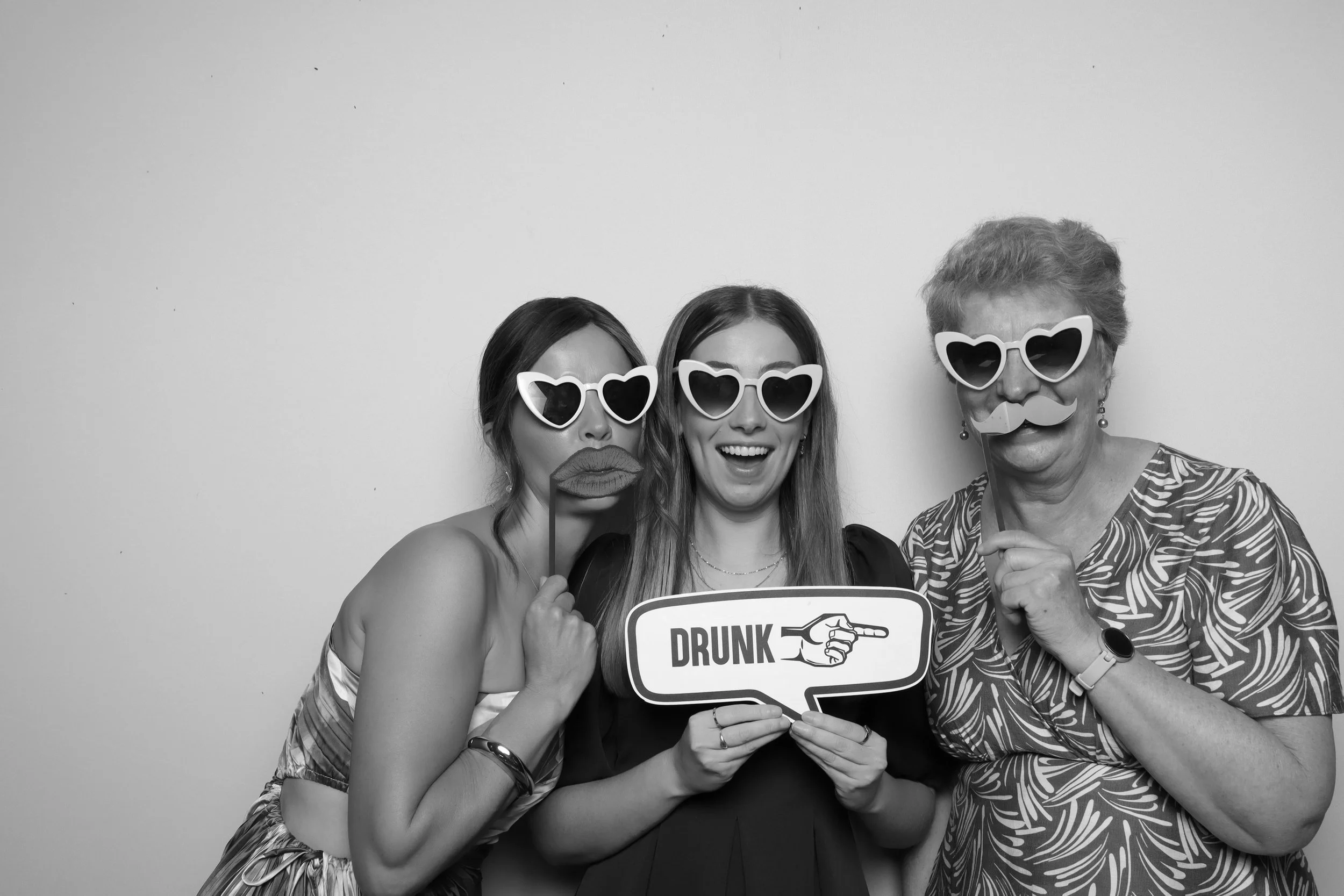 Mother of the bride and groom in black and white photo booth Melbourne wedding