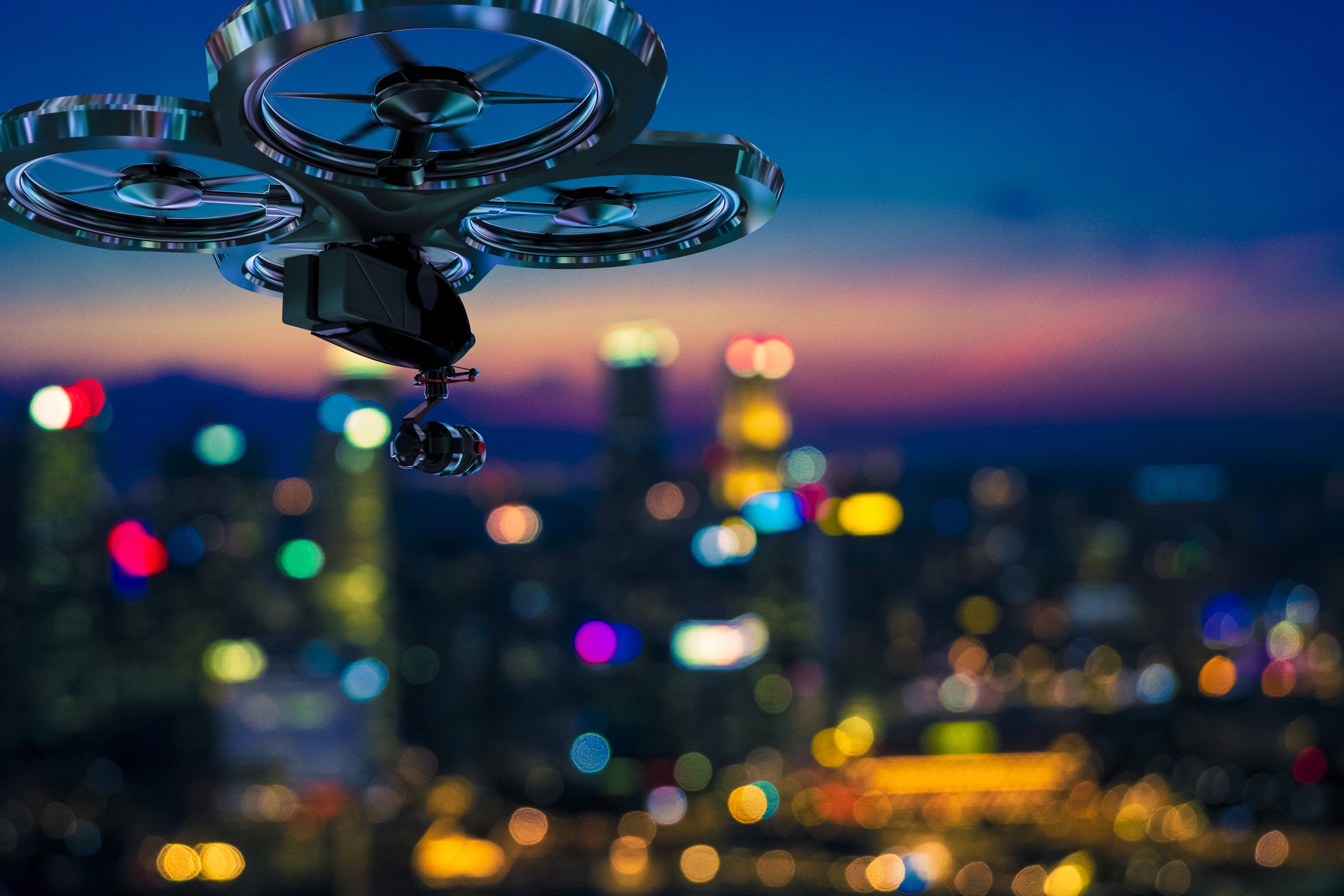 A drone flying over a city skyline at sunset with colorful bokeh lights in the background.
