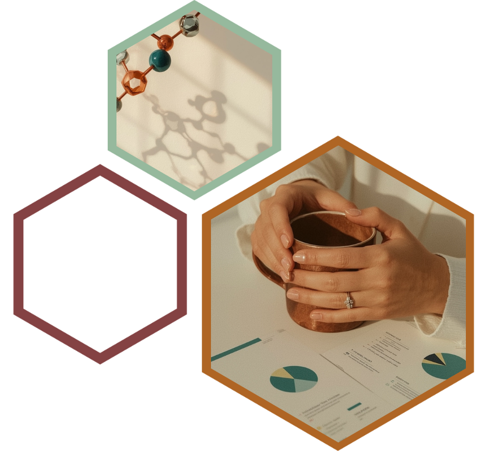 Hands cradling a copper mug over printed charts and reports.