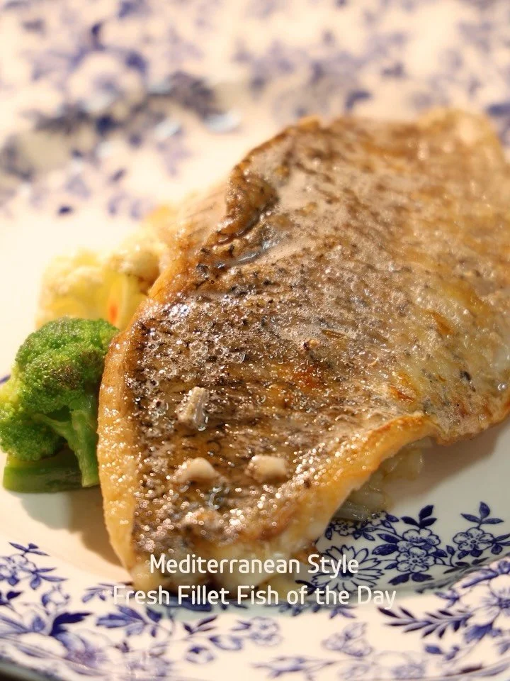 As fresh as a sea breeze.⁠

Mediterranean-style fish of the day with herbs, lemon, and garden vegetables &mdash; best enjoyed unhurried.⁠