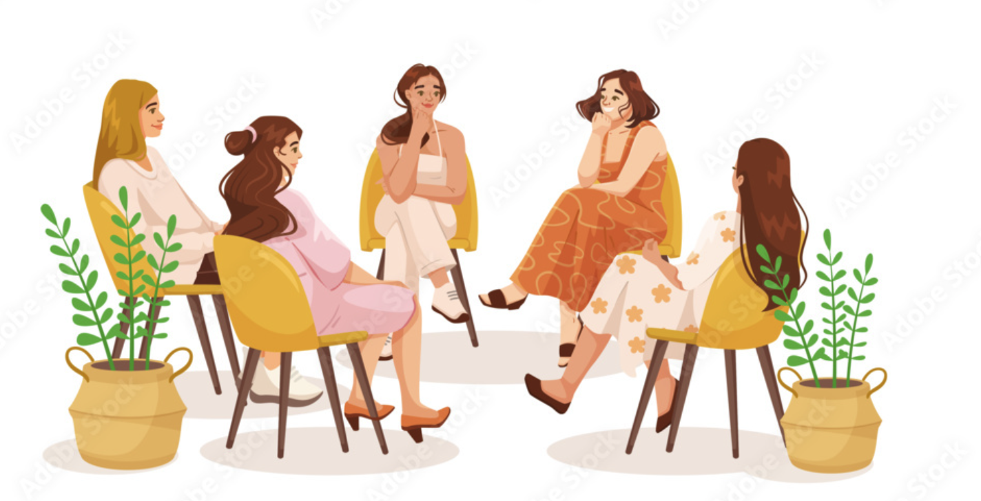 Five women sitting in a circle, having a conversation, with two potted plants on either side.