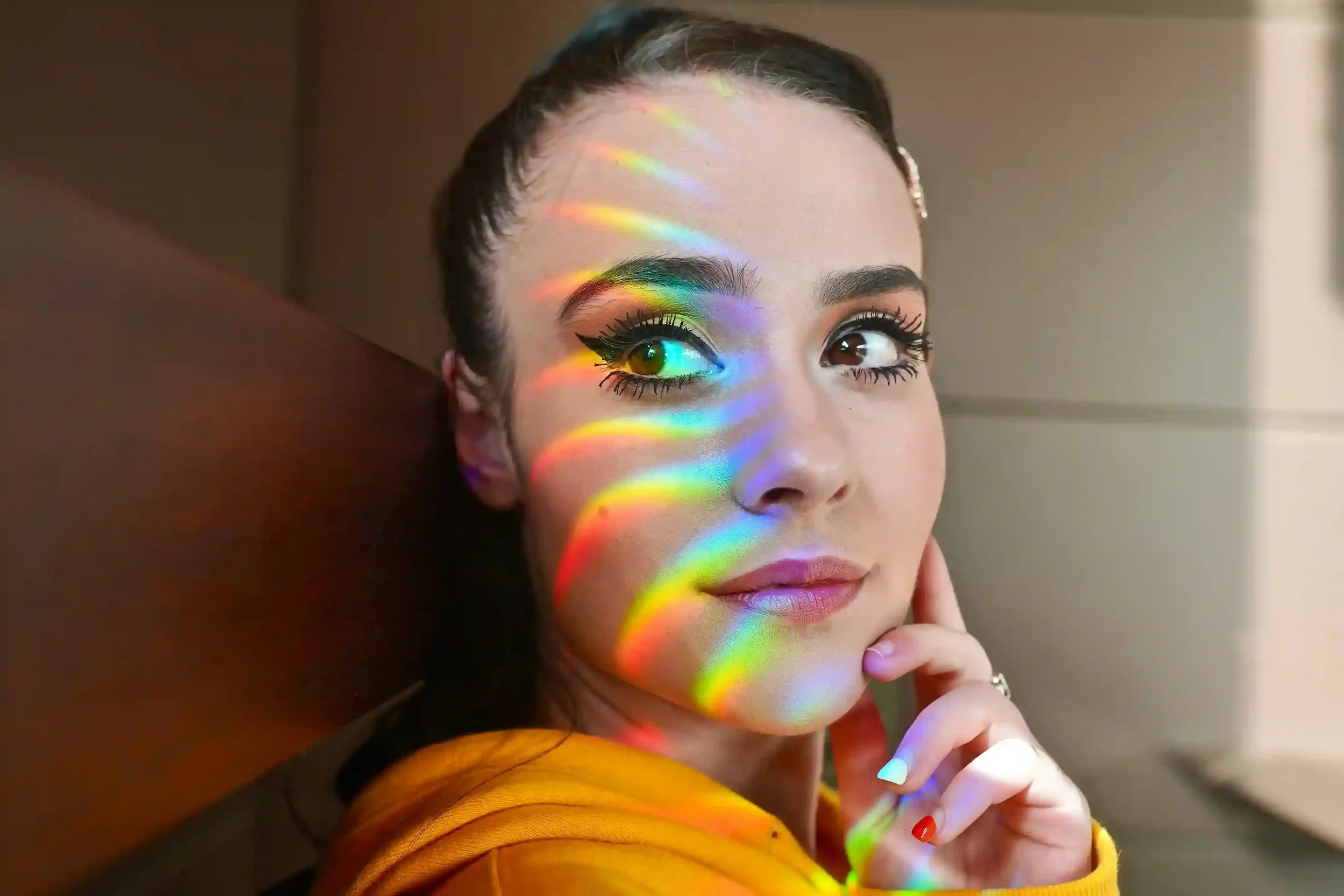 Rainbow light across face symbolizing Celluma LED light therapy benefits at Truly Esthetic Vancouver WA