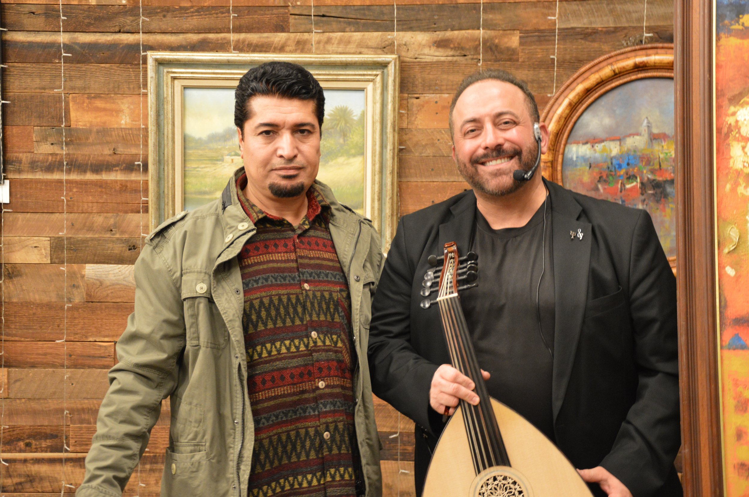 Iraqi visual artist Ahmed Alkarkhi standing alongside Iraqi musician Laith Alattar at the Middle Eastern Arts Collective inaugural art gallery.