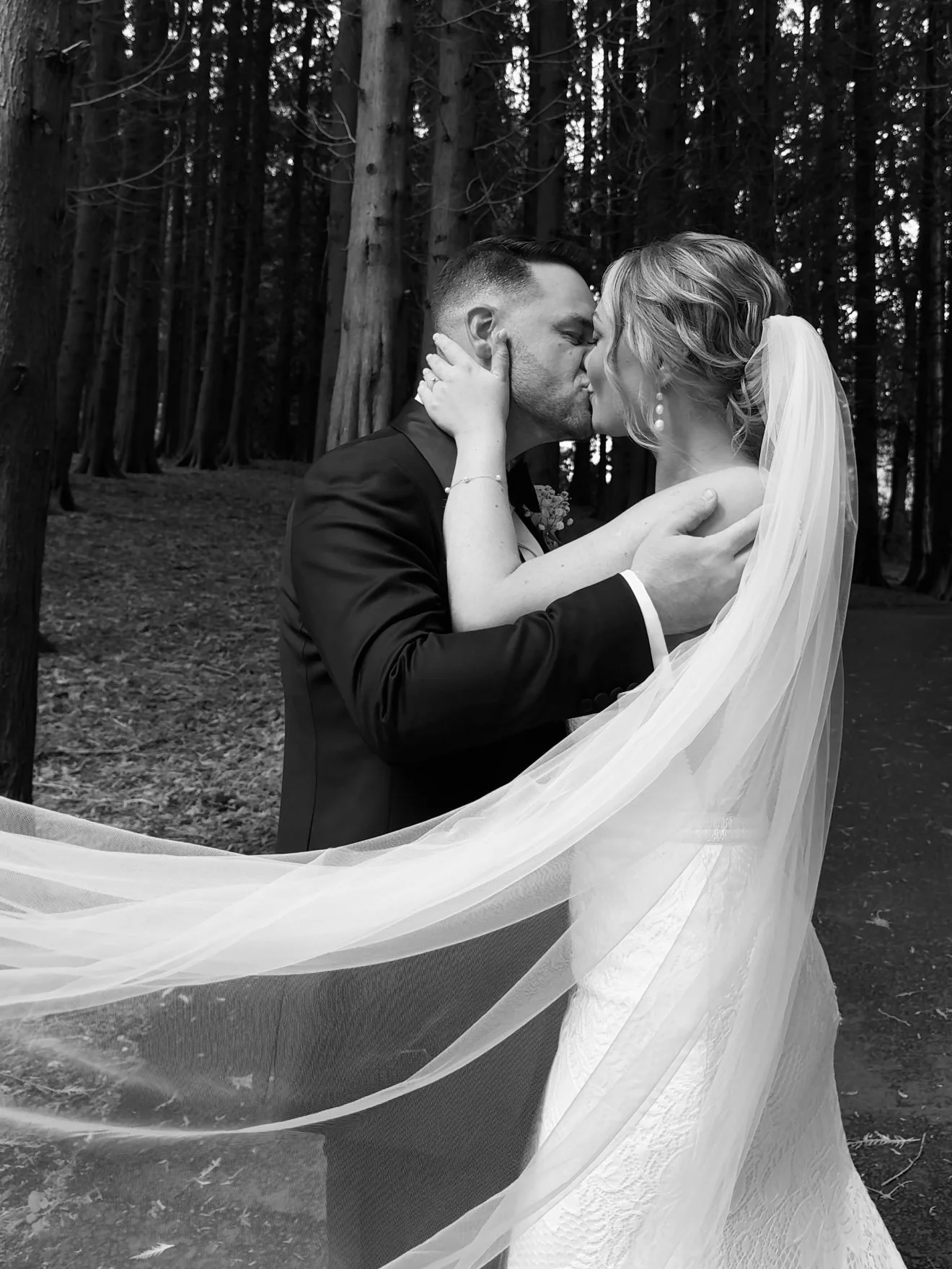 Newly weds Joe and Sophie kissing at Foxtail Barns, Staffordshire