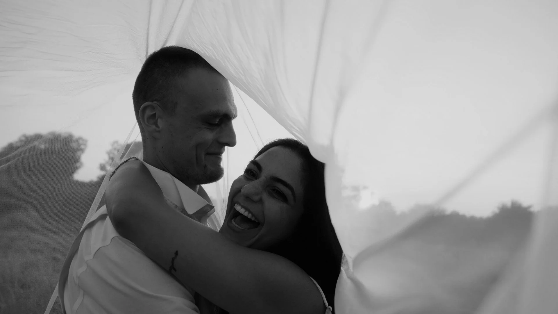 Neesha and Tom embracing at their wedding