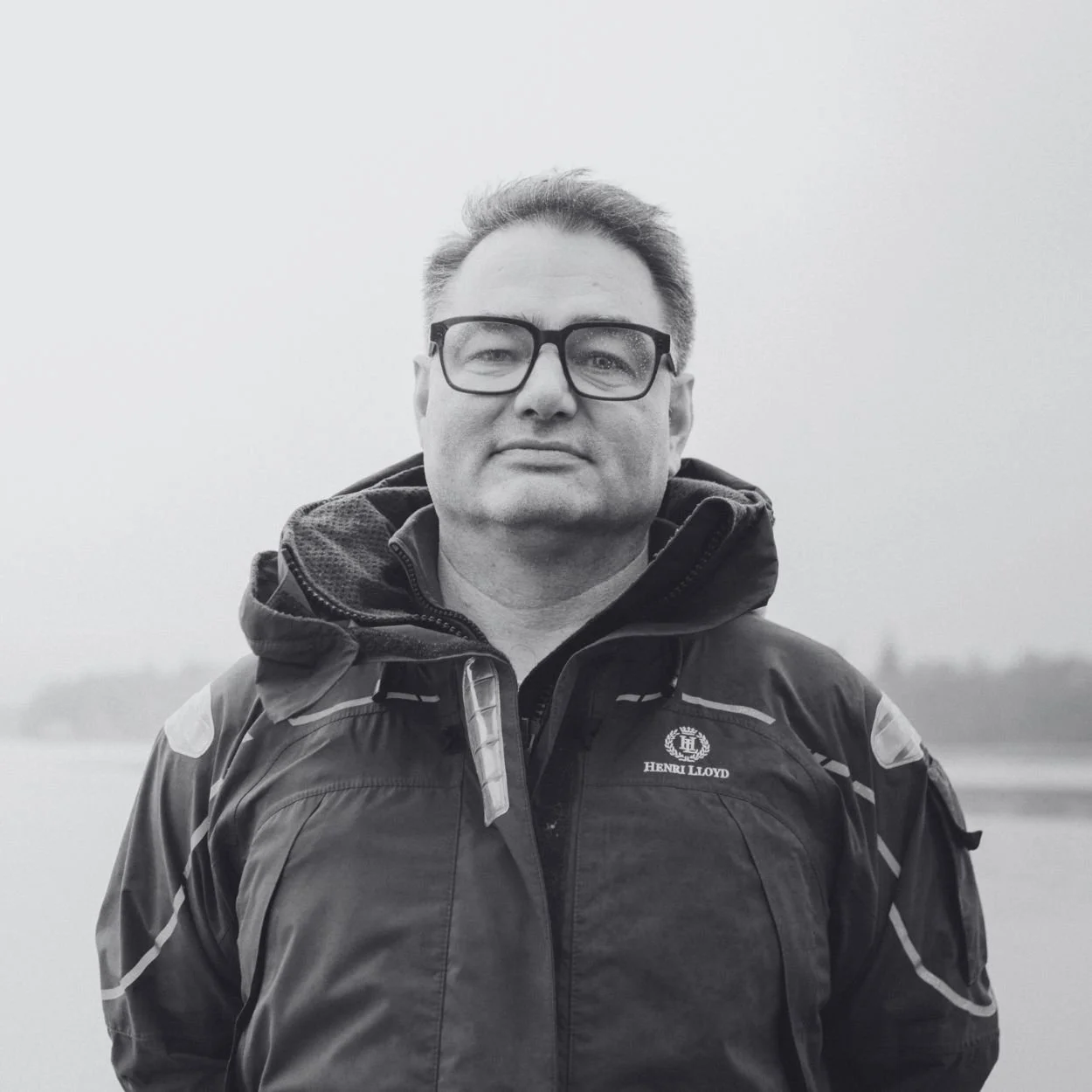 A man with glasses and a beard.