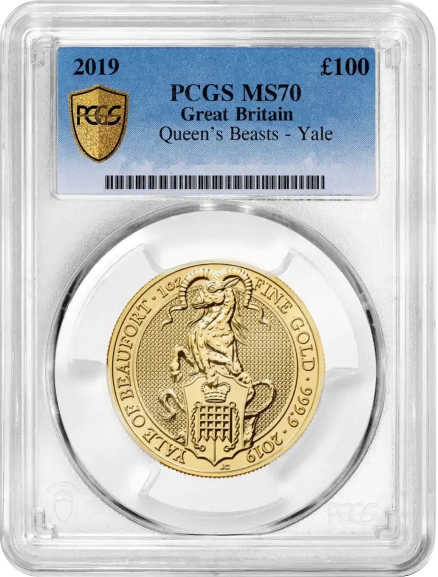 A gold coin encapsulated in a plastic holder with a blue label on top indicating grade MS, issued in 2019 by PCGS, worth 100 pounds, from Great Britain, Queen's Beasts - Yale series.