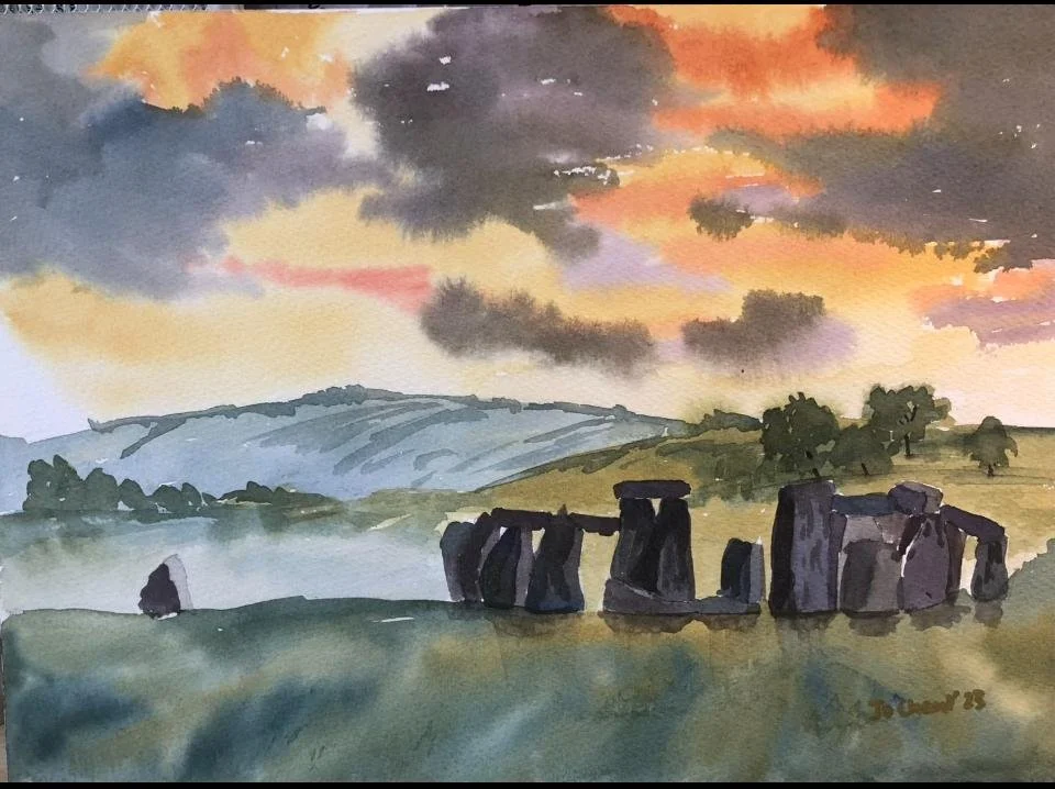 A watercolor painting of Stonehenge during sunset, with a colorful sky filled with clouds, rolling hills, and trees in the background.