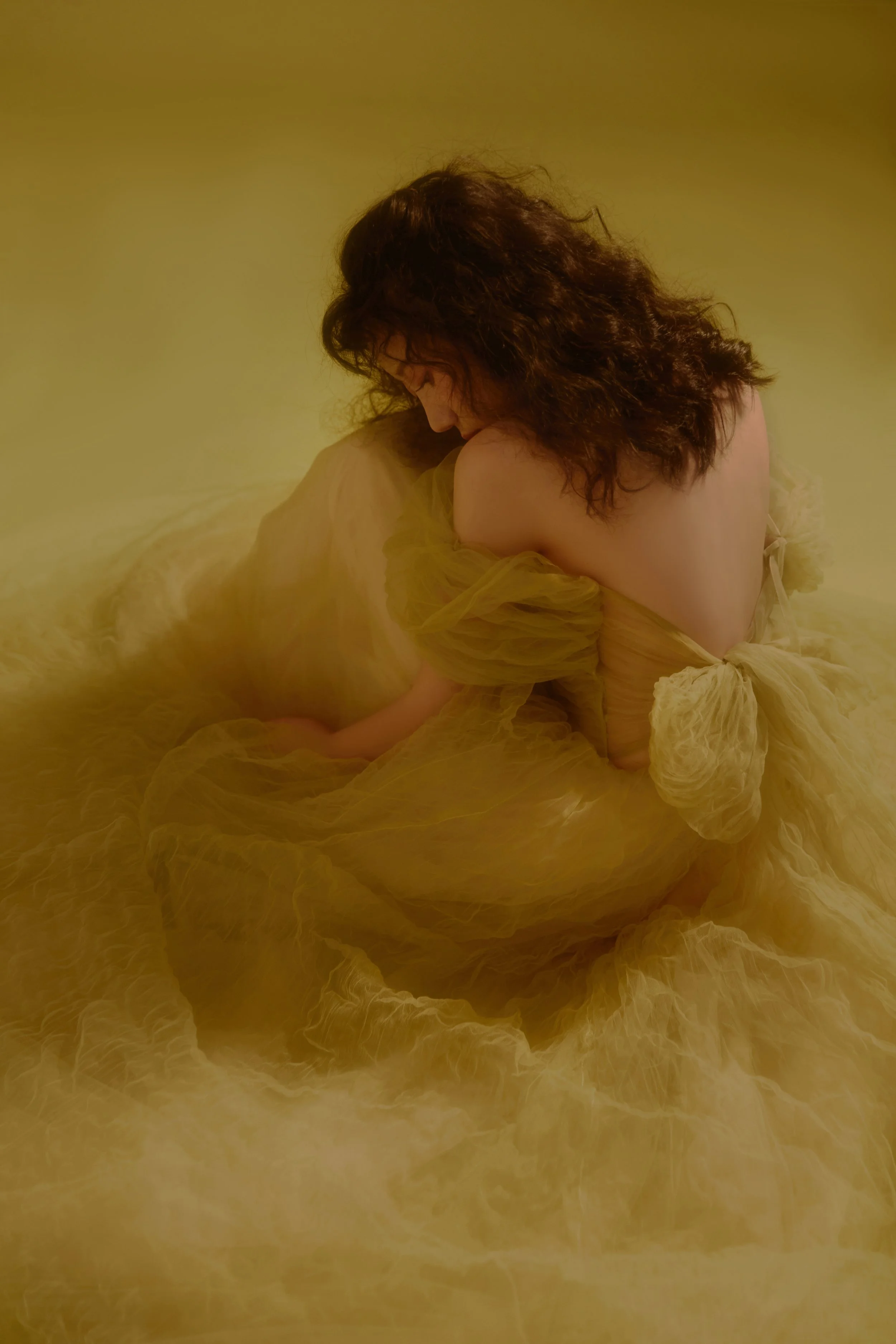 Close-up of a woman underwater in a swimming pool, wearing a red strapless top, with sunlight creating patterns on her skin, and the text 'La Boheme' overlaid.