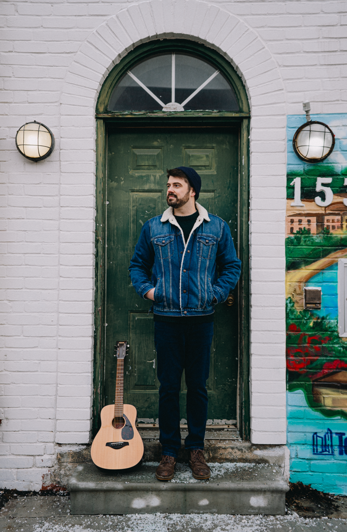 Close-up of a woman underwater in a swimming pool, wearing a red strapless top, with sunlight creating patterns on her skin, and the text 'La Boheme' overlaid.