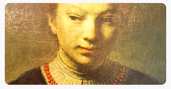 A shy young woman glancing to the side in a painting by Rembrandt