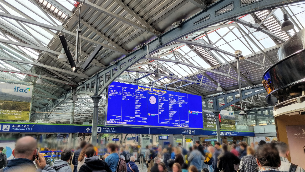 People waiting for a train on a crowded platform