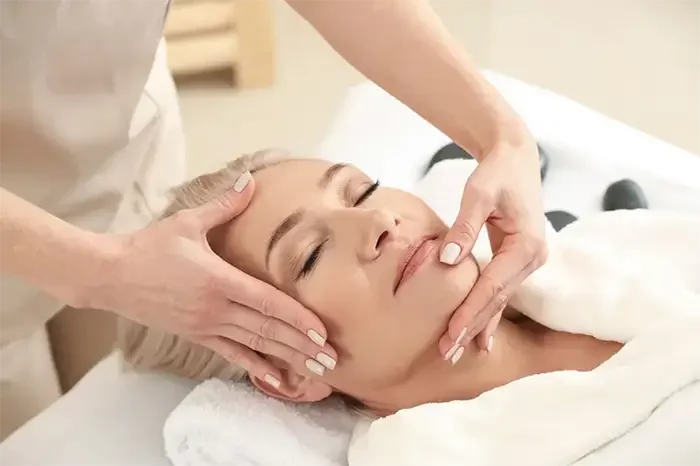 woman receiving facial treatment