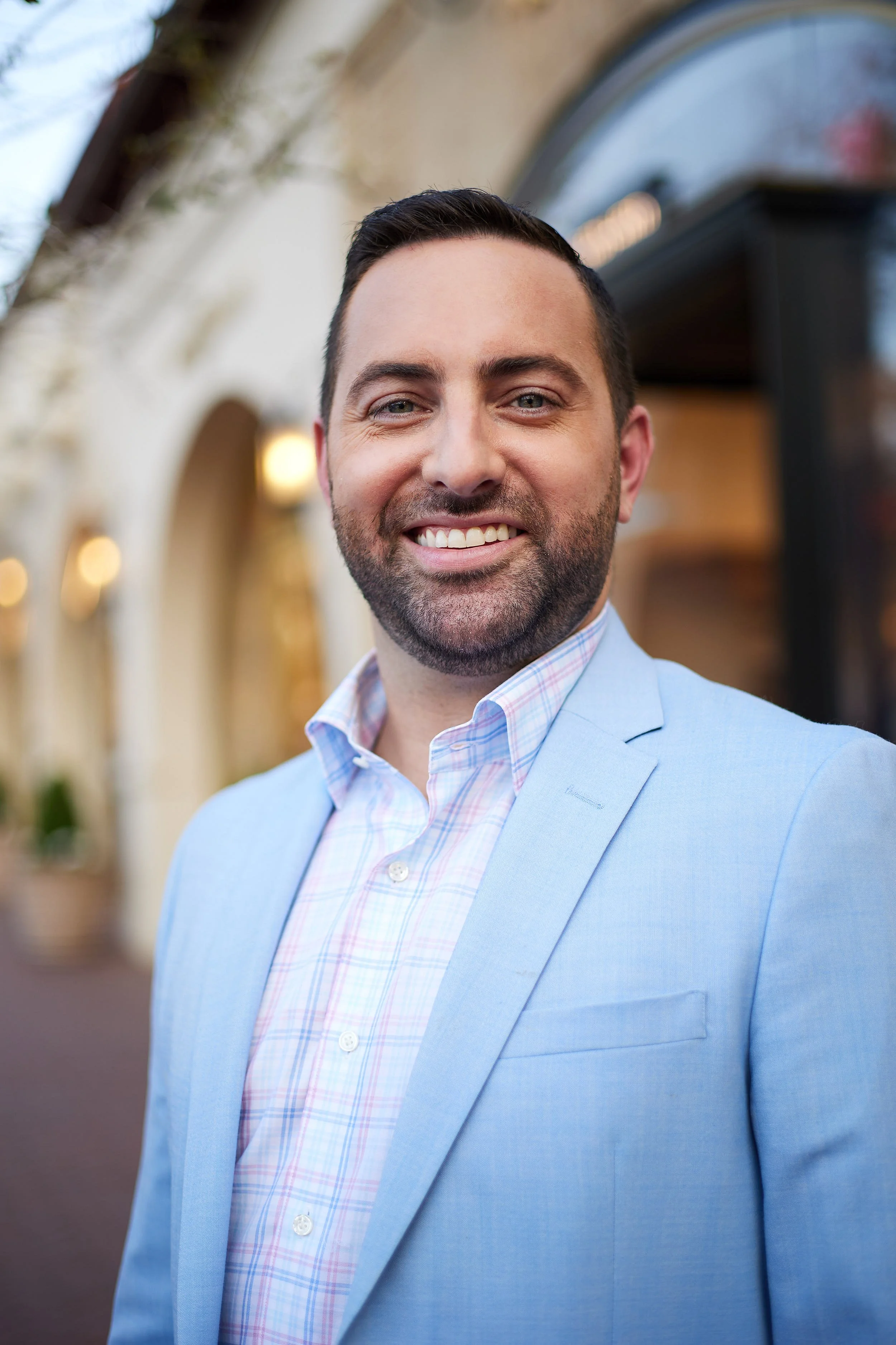 Outdoor portrait session of man in blue suit in Dallas, TX.