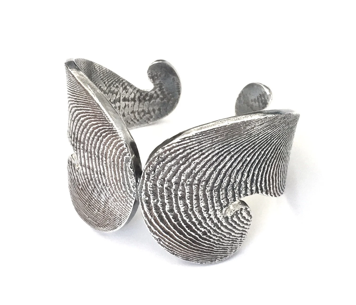 Award winning Cuttlebone cast silver cuff bracelet designed to resemble fingerprint patterns with textured surface.