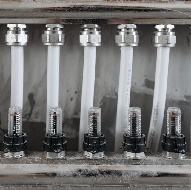 colorful PEX manifold pipes in mechanical room with shutoff valves