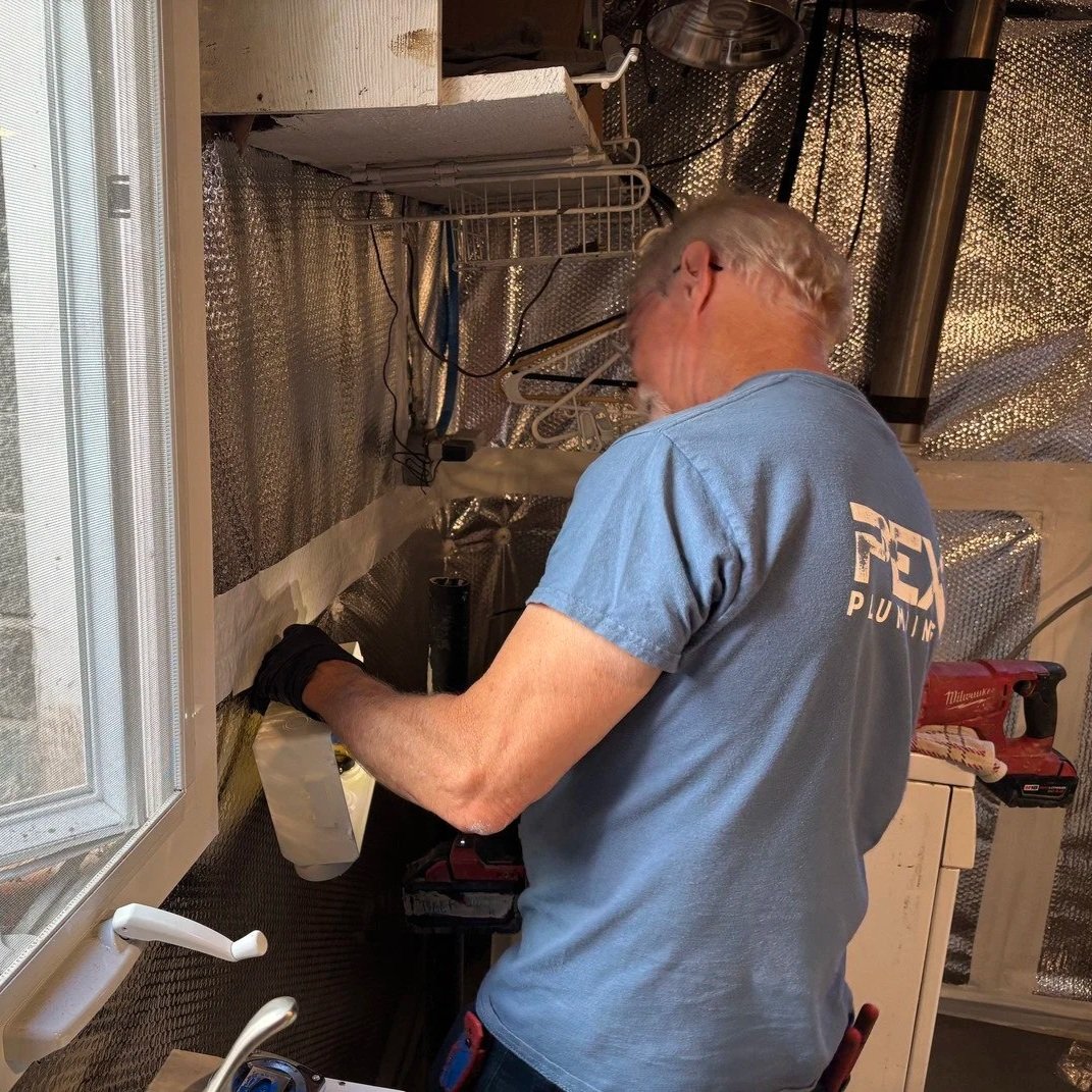 Modern PEX repiping installed in multi-unit Hillsboro building, replacing old corroded pipes, ensuring consistent water pressure and reliability.