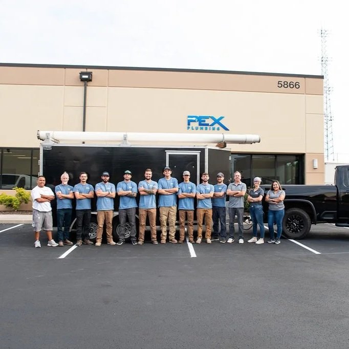 Professional plumber inspecting PEX piping in a Hillsboro home, addressing recurring leaks, pressure issues, and planning full repiping solution.